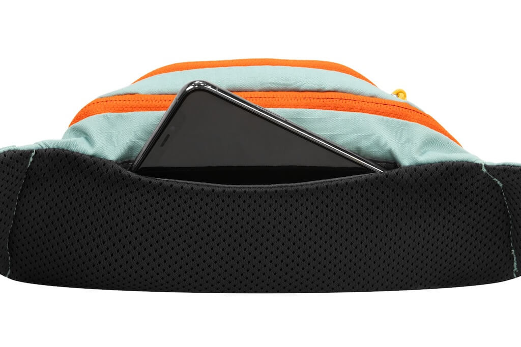 Showing the back pocket where your phone can be stored in the Ruffwear HOme Trail Hip Pack.