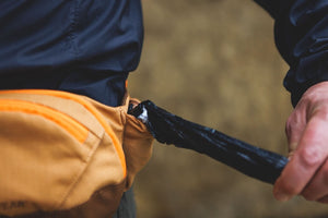 A close up showing the side of the Ruffwear Home Trail Hip Pack where poo bags (clean ones) can be stored.