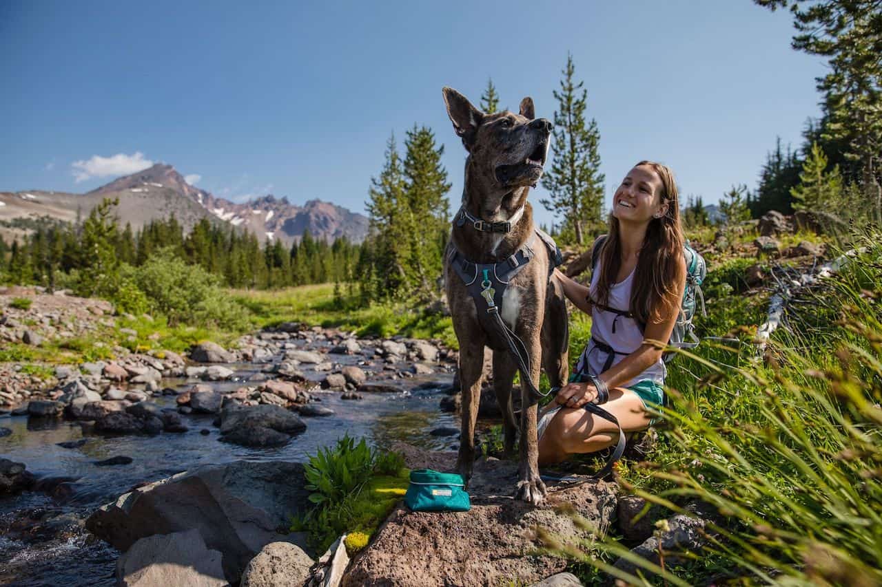 Ruffwear Quencher Bowl in Teal Showing a Happy Dog & Grl
