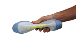 Man holding a Ruffwear Camp Flyer folded showing it's flexibility