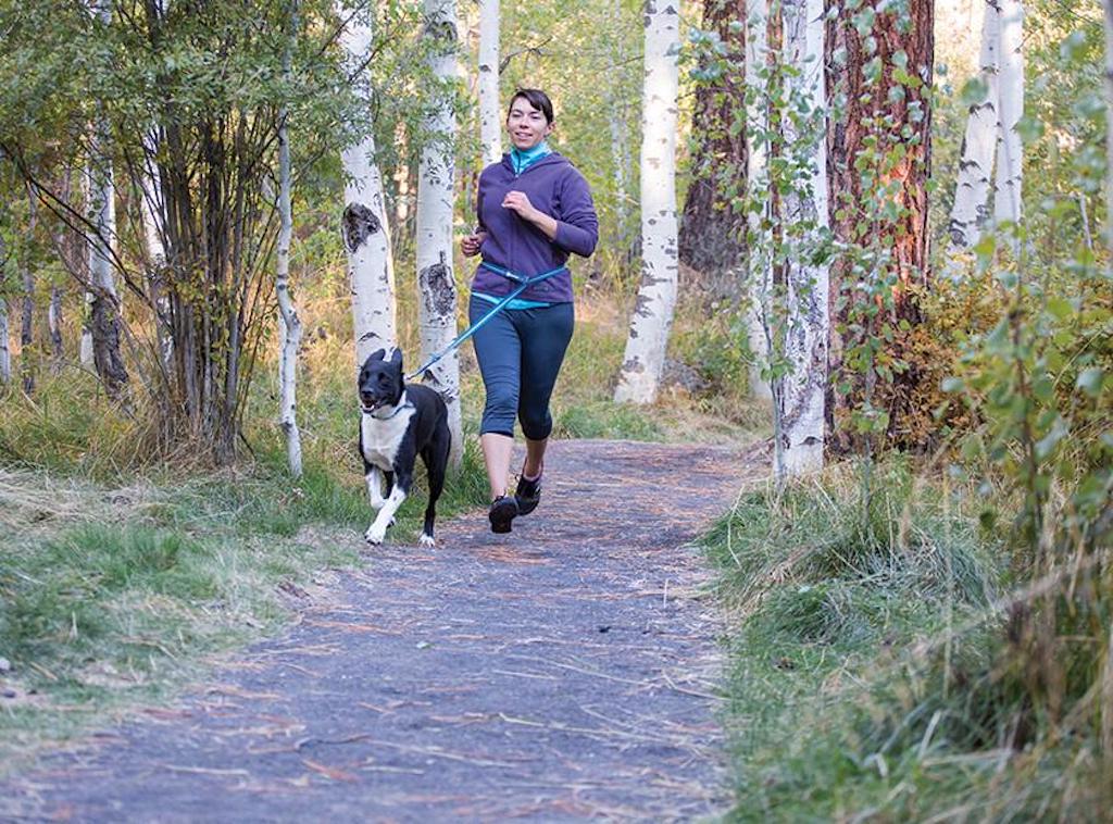 Ruffwear Crag Dog Leash lifestyle showing it being worn around the waist while running
