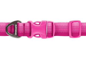 A close-up of a bright Pink Mountains webbing dog collar with a matching pink plastic quick-release buckle and a aluminium metal D-ring. The D-ring has the brand name 'RUFFWEAR' printed on it in white.