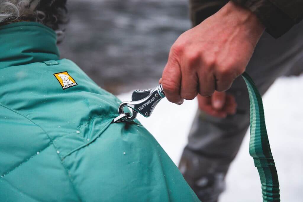 Ruffwear Quinzee Dog Coat in River Rock Green close up of leash portal