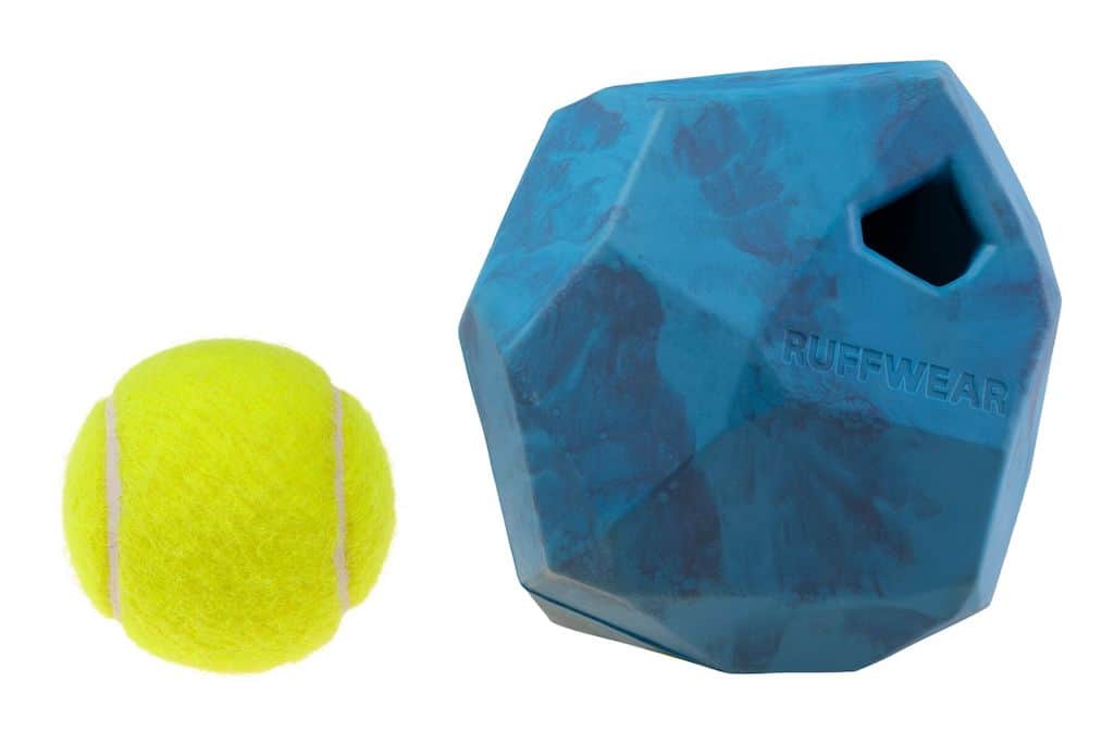Ruffwear Gnawt-a-Rock showing size compared to a tennis ball