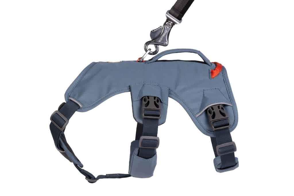 A side angle shot of the Ruffwear Web Master Harness showing the secure side clip buckles and the main aluminium leash attachment point.